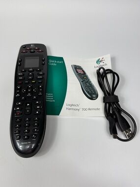 Logitech Harmony 700 Remote with Charging Cord & Manual. 
Minor scratching